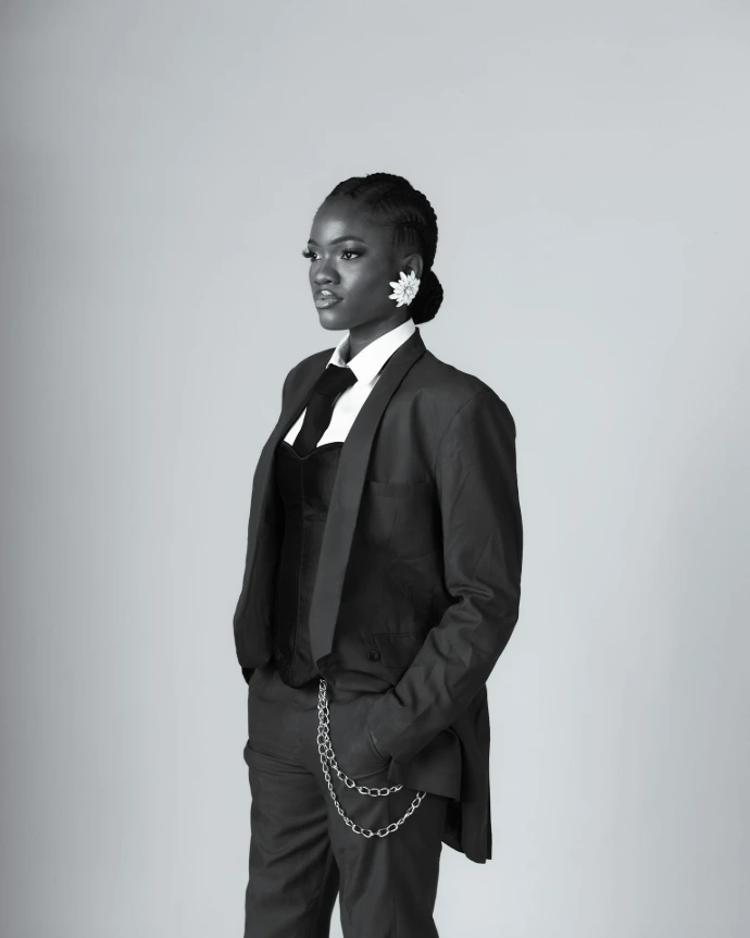 Woman in a suit with hands in pockets